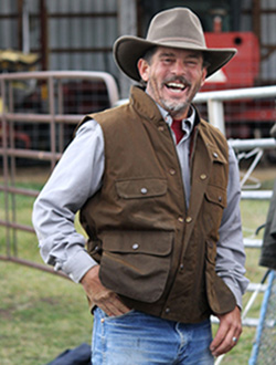 man wearing oilskin vest